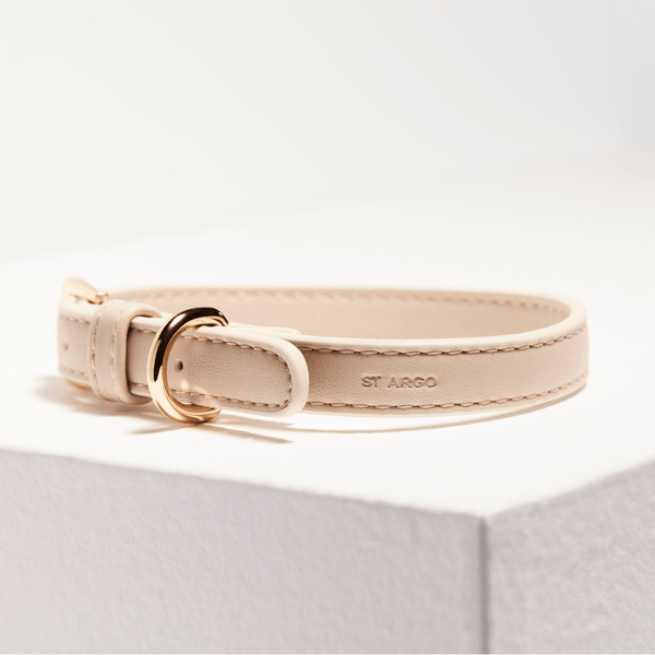 side view of embossed logo on taupe collar
