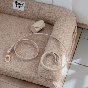 the taupe leash and poop bag holder