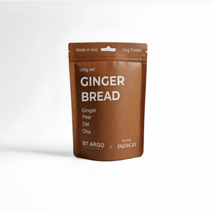 Brown package of gingerbread dog treats with visible branding on a white background