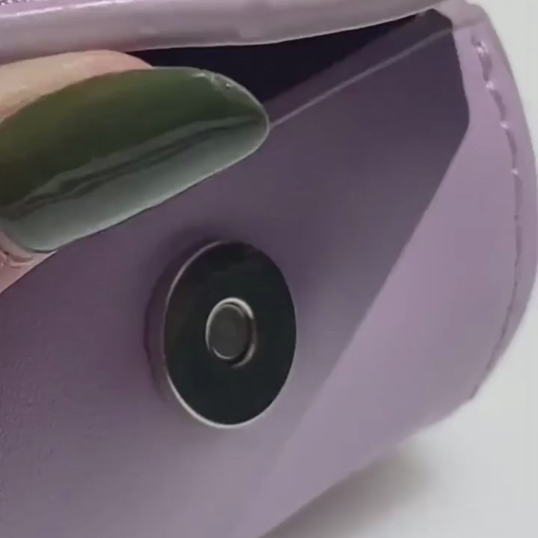 video of the magnetic closure opening on the lilac vegan leather ST ARGO dog waste bag dispenser