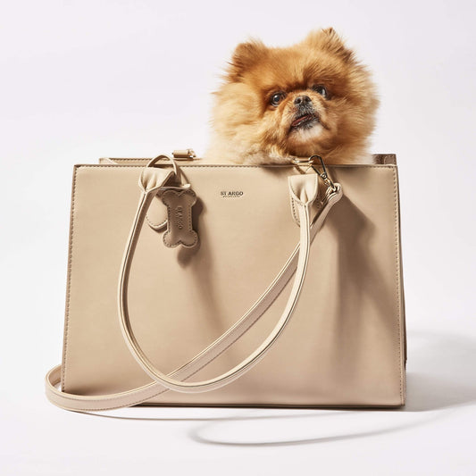 Beige LOLA dog carrier in vegan leather. With a pomeranian