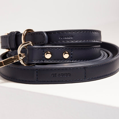 Navy blue dog lead by St Argo with gold hardware