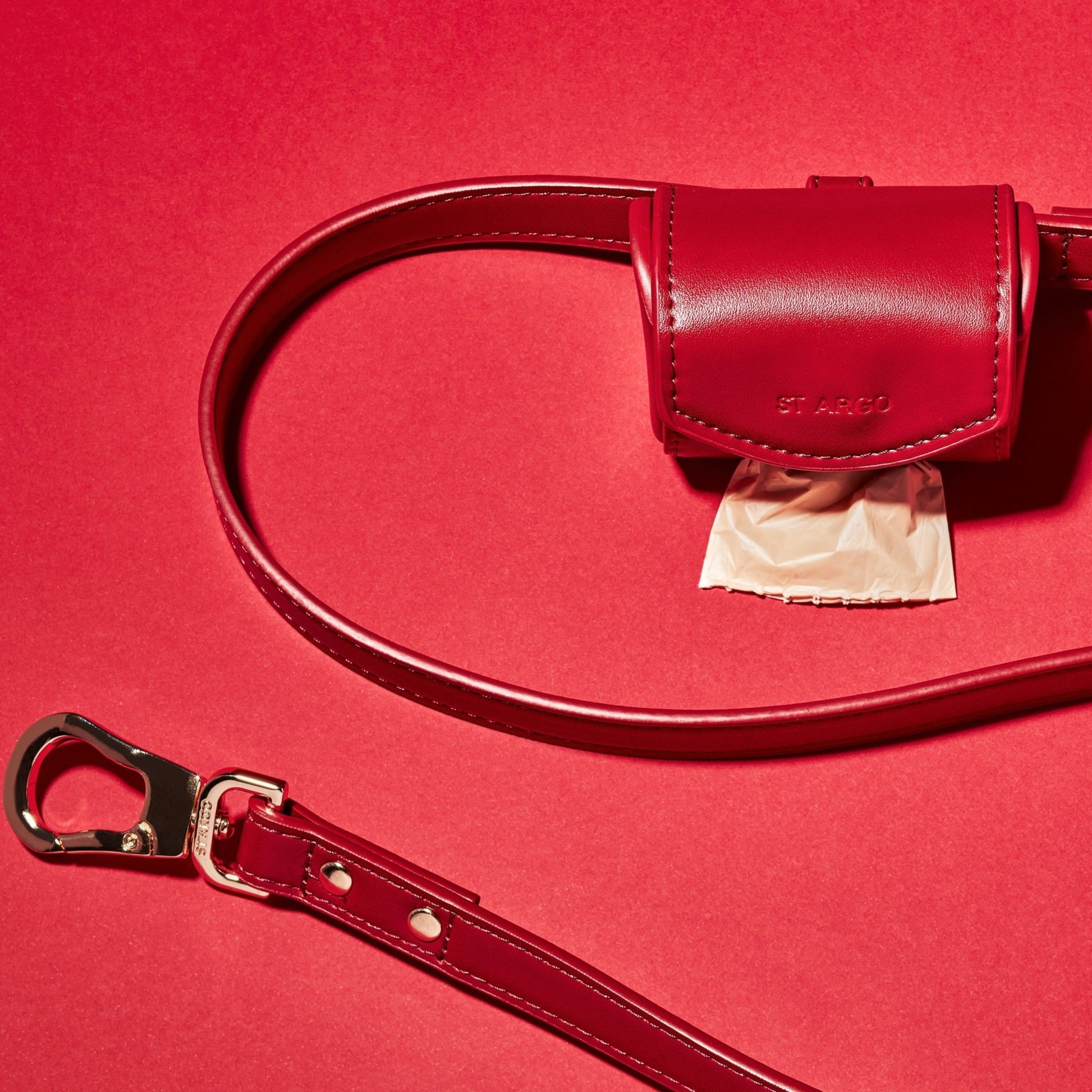 Ruby red poop bag holder in vegan leather on lead